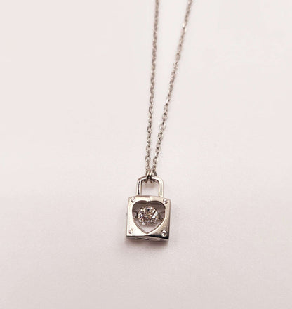 Dancing Gemstone Love Lock Pendant in sterling silver with adjustable chain.