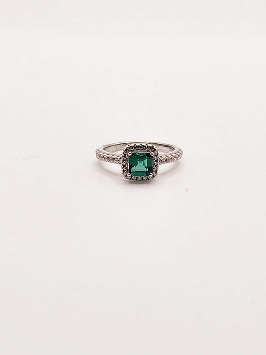 Lab created green sapphire halo ring in 925 sterling silver with round cut stone.