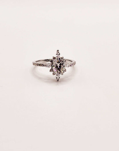 Moissanite engagement ring with multi-shaped gemstones in 925 sterling silver.