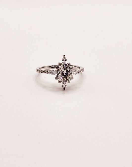 Moissanite engagement ring with multi-shaped gemstones in 925 sterling silver.