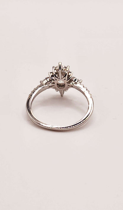 Elegant multi shaped moissanite engagement ring in 925 sterling silver.