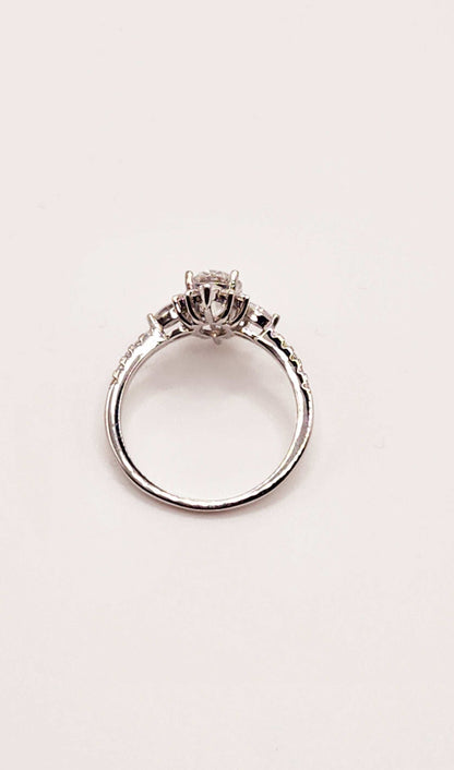 Multi Shaped Moissanite Engagement Ring in 925 Sterling Silver with round cut moissanite gemstones.