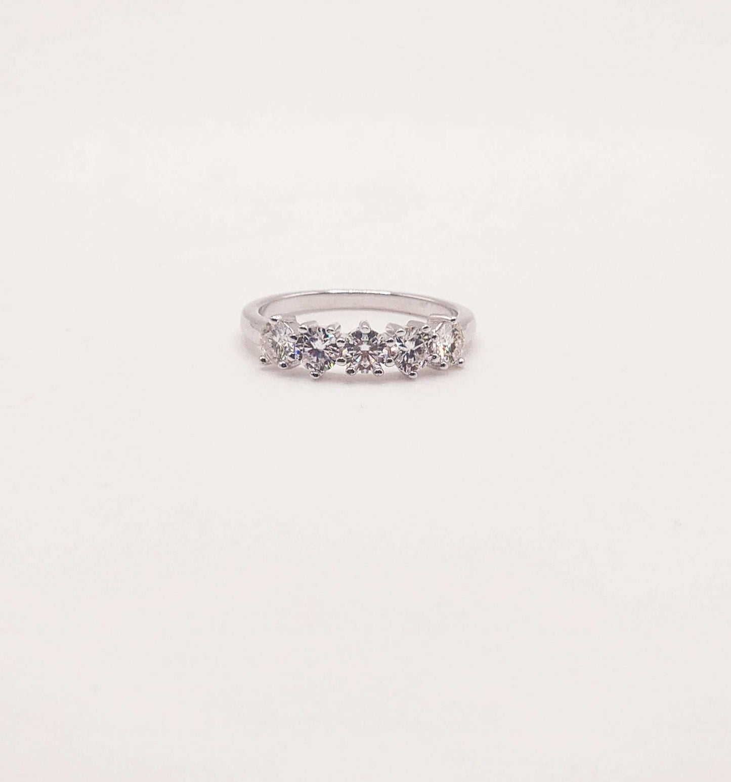 Five Stone Moissanite Wedding Band in 925 Sterling Silver with round cut stones.