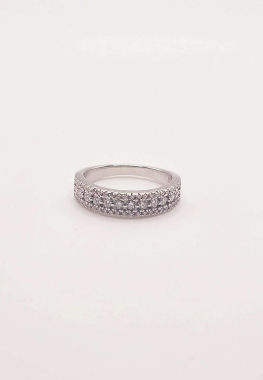 Triple Row White Sapphire Half Eternity Band in sterling silver with round cut sapphires.