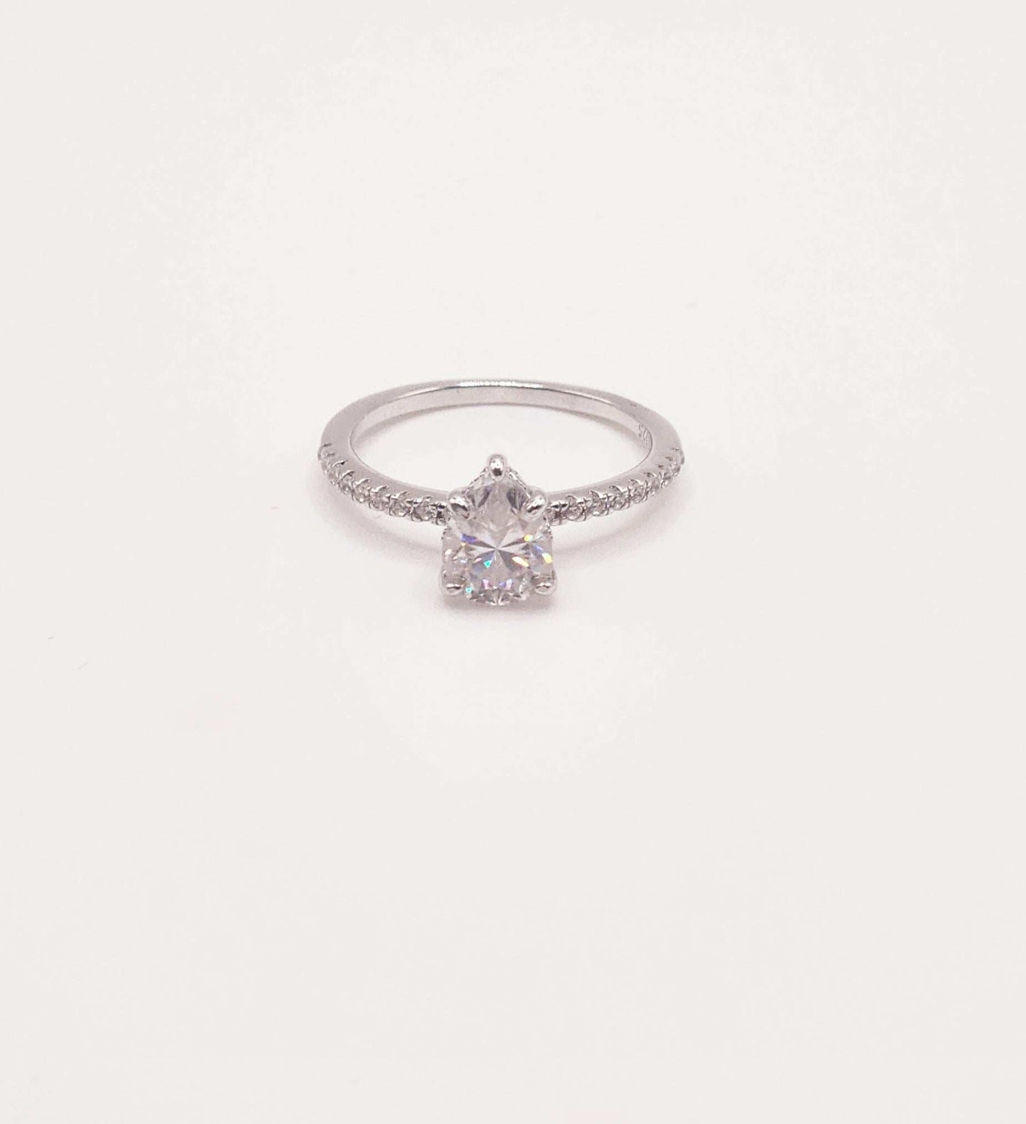 Pear Moissanite Pave Engagement Ring with 1 carat pear-shaped stone in sterling silver.