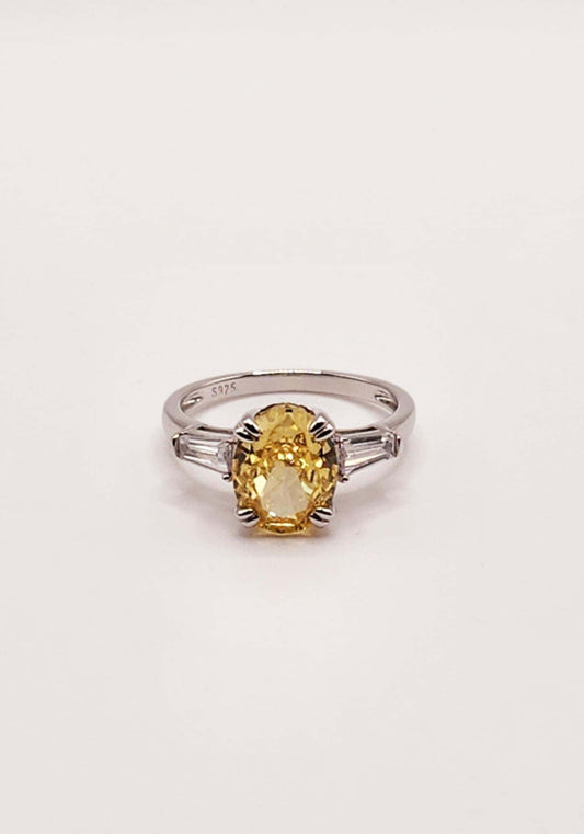 Colored Cushion Sapphire Sterling Silver Ring with yellow sapphire centerpiece and baguette side stones.