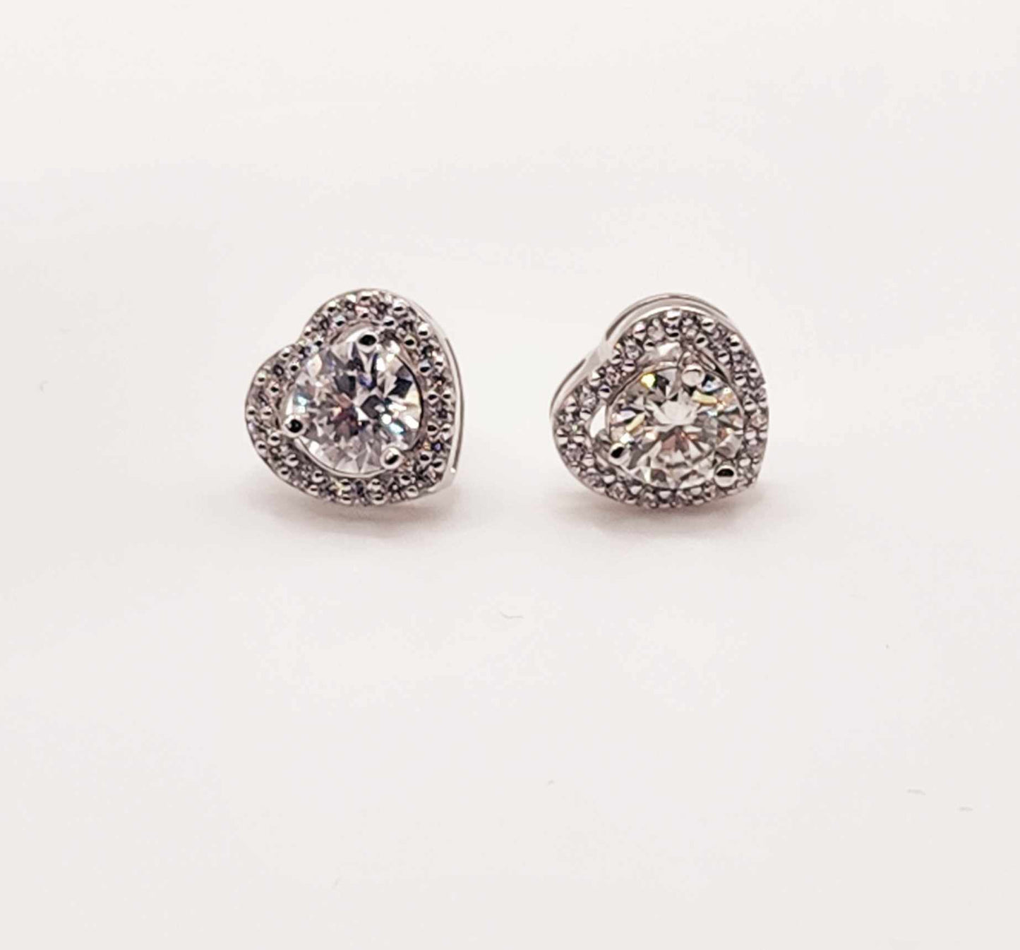 Halo Heart Moissanite Sterling Silver Stud Earrings with heart-shaped stones and halo design.