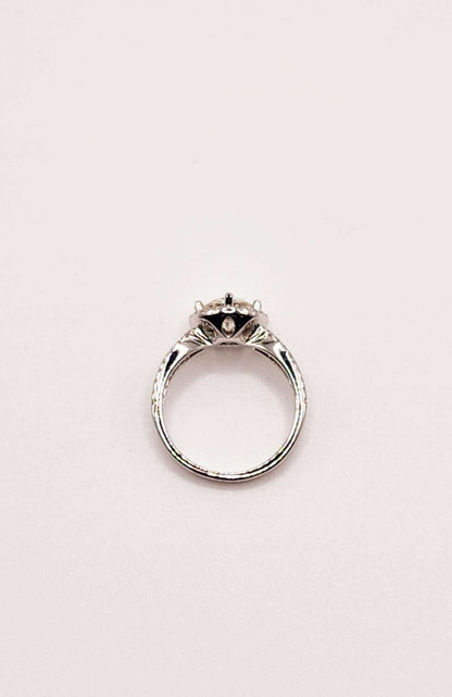 Round Moissanite Split Shank Halo Engagement Ring in sterling silver.