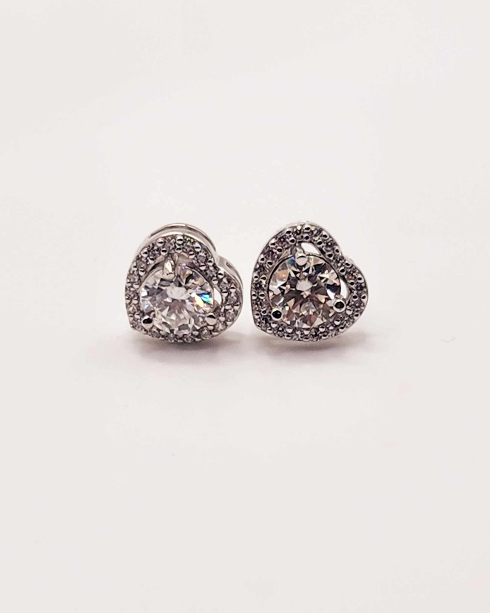 Halo Heart Moissanite Sterling Silver Stud Earrings with 1 Carat heart-shaped moissanite stones.