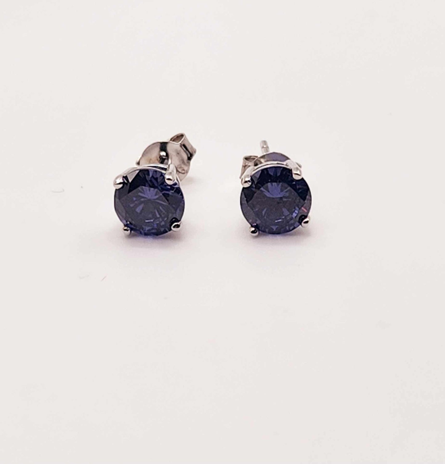 Amethyst Solitaire Stud Earrings with round cut gems in 925 sterling silver.