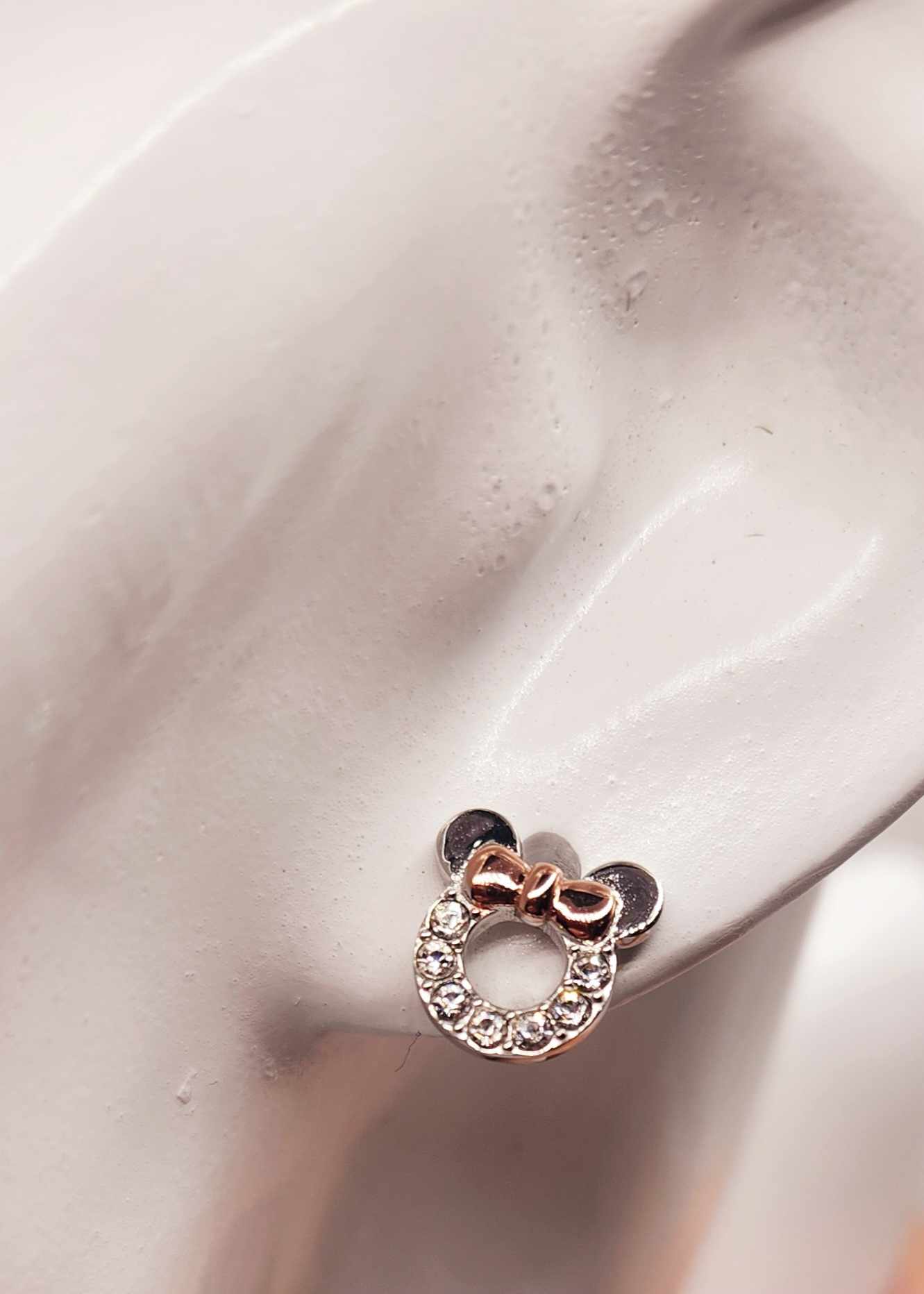 Minnie Mouse inspired pave stud earrings with iconic bow and rhinestones on sterling silver.