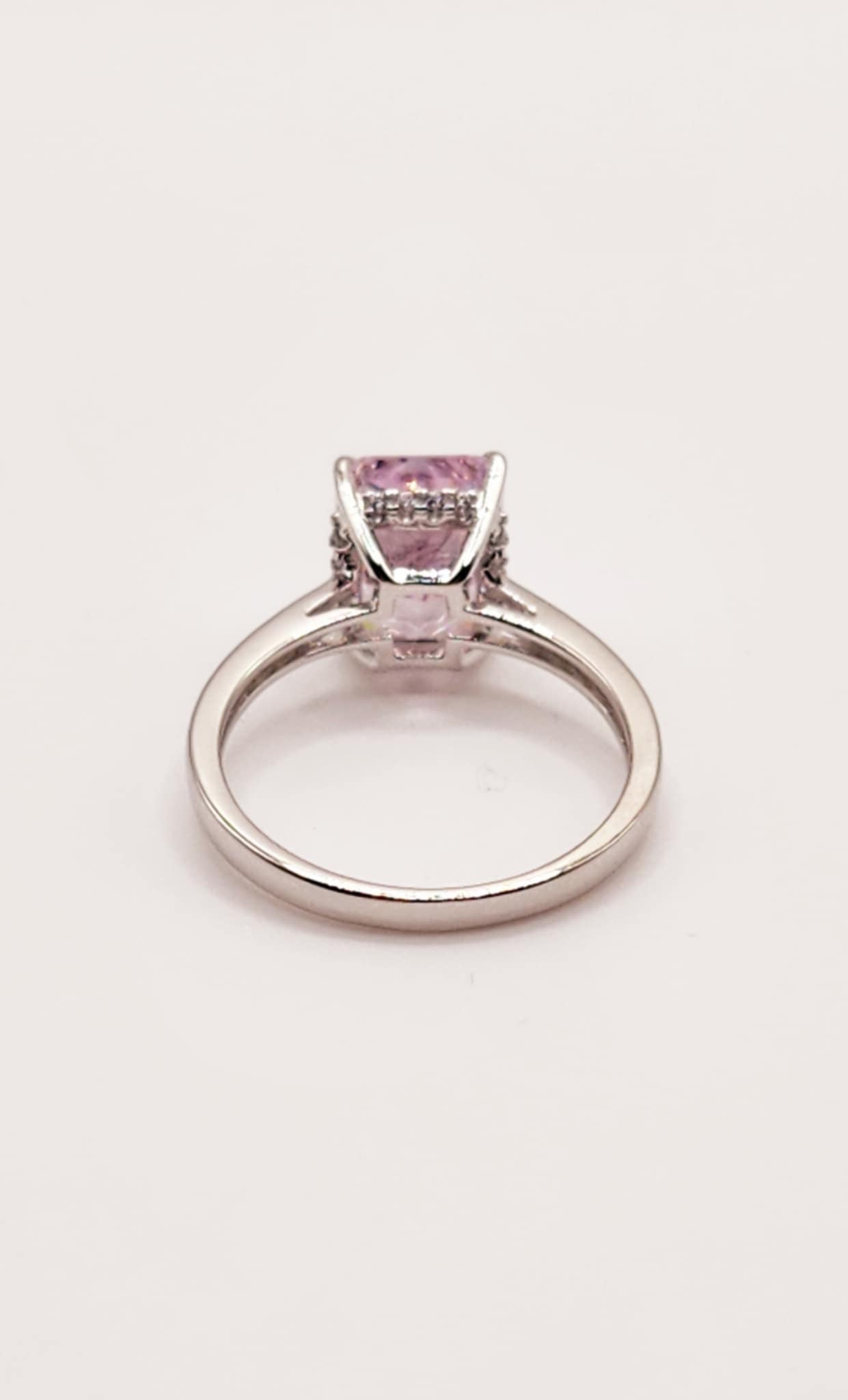 Classic pink radiant cut sterling silver ring with a 2.5 carat baguette stone.